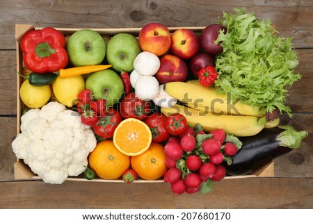 Healthy eating vegetarian fruits and vegetables in a box from above