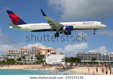 ST. MARTIN - FEBRUARY 8: A Delta Airlines Boeing 757 approaching on February 8, 2014 in St. Martin. St. Martin is rated one of the most dangerous airports in the world.