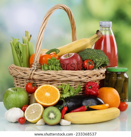 Fruits, vegetables, vegetarian groceries and healthy beverages in a shopping basket