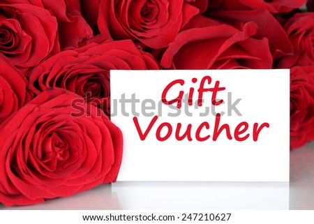Red roses with gift voucher certificate for birthday, Valentine\'s or mothers day