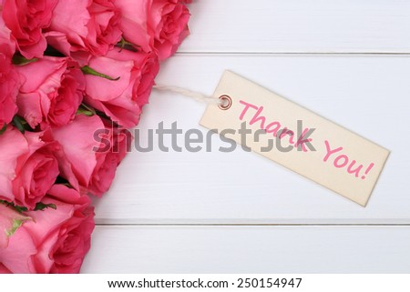 The words Thank You with roses flowers on a wooden board on mother\'s or Valentine\'s Day