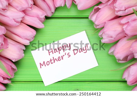 Happy mother\'s day with tulips flowers and greeting card with copyspace