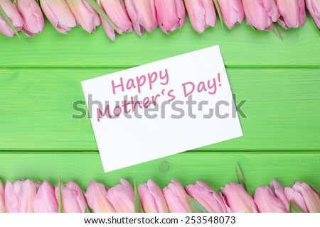 Tulips flowers with greeting card and the text Happy mothers day with copyspace