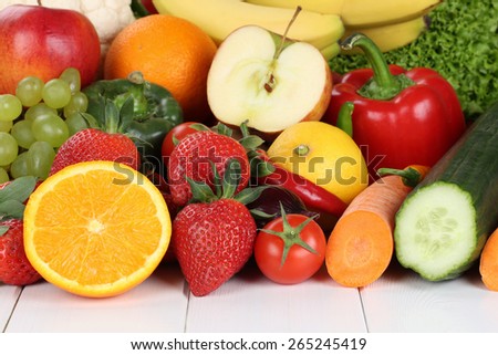 Fruits and vegetables like oranges, apple, tomatoes, banana, strawberry
