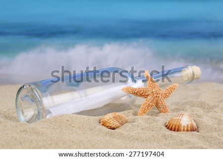 Beach scene in summer on vacation with bottle post and copyspace