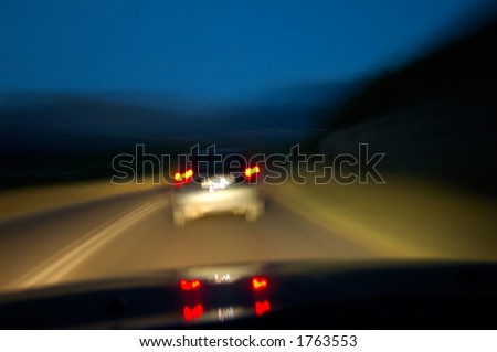 Night drive. Image of a country road ahead at night taken from a driver’s POV