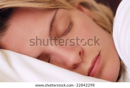 Closeup image of a beautiful young woman sleeping peacefully
