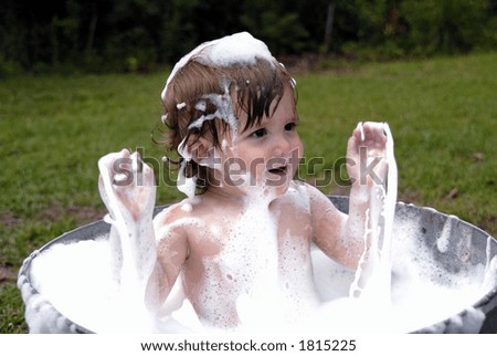 A Splashing Good Time in a a tub outside on a hot summer afternoon