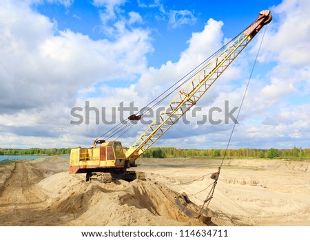 Crane in the earth career against the sky