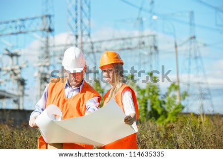 woman and man working as architects on a construction site