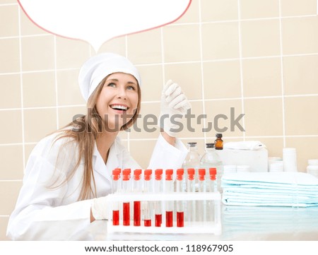 woman in medical gown with tubes of blood