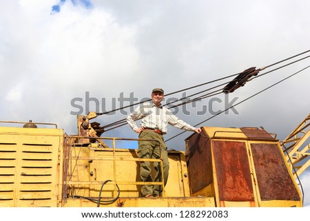 man standing  driver   excavator crane
