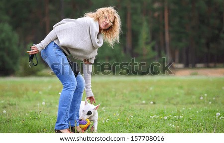 portrait of a woman on a walk with the dog