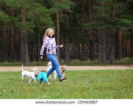 Beautiful  run  woman withyoung dog