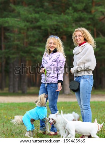 Two women on a walk with the dogs