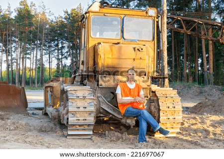 positive driver of heavy equipment rests in the workplace