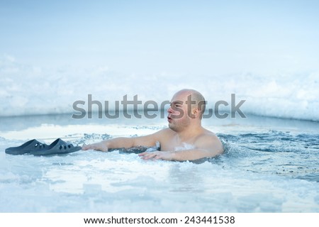 Traditional Russian  winter recreation - swimming in the ice-hole