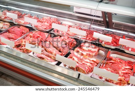 raw beef and pork in a butcher shop