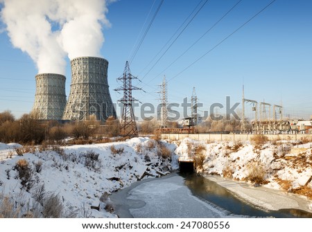 view of power heat station, smoke from the chimney on a frosty winter day