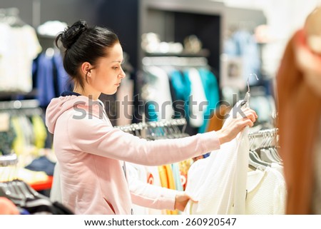 Nothing to wear concept, young woman deciding what to put on