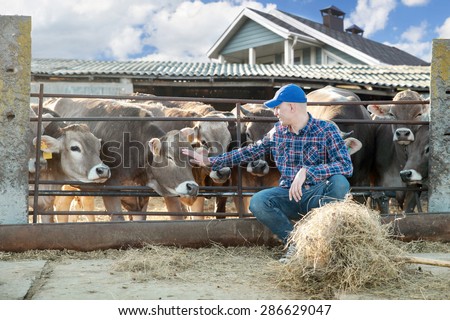 Portrait Of Farmer With Cattle