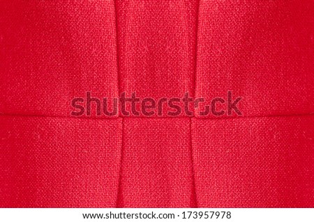 Red fabric texture with horizontal and vertical sewing lines