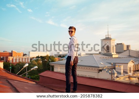 Young bold girl woman hipster, walking on roof and smiling