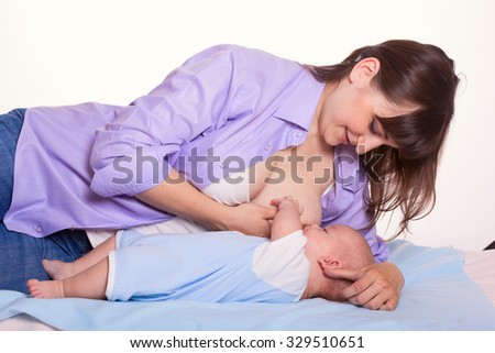 Cute happy family mother mum breastfeeding baby boy girl on white background
