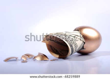 Hatched golden egg and cash