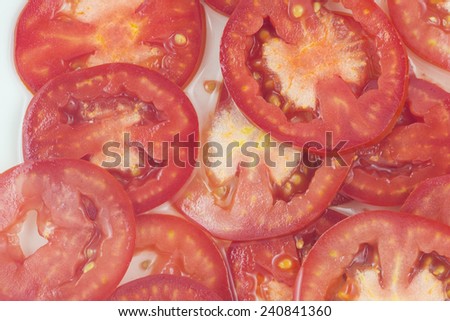 Tomato slices. Natural background with slices of tomato.