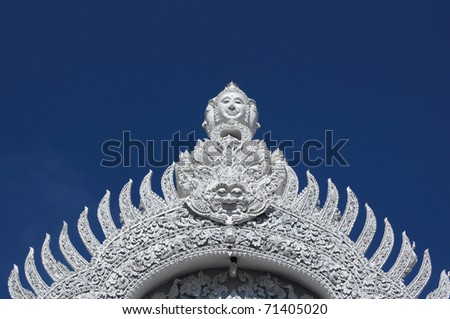 Thailand buddha pattern door with dark blue sky