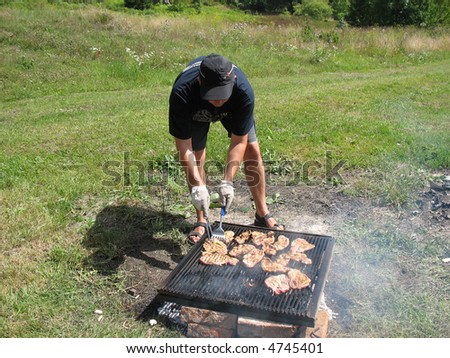 preparing steak on outdoor grill