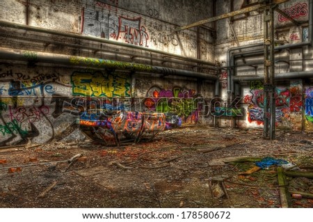 Broken car in an abandoned hall