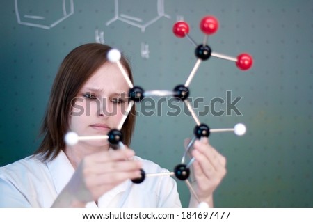 Student examines a molecular model