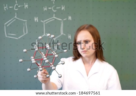 Woman with a molecular model