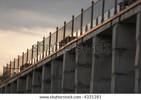 fence and benches on concrete wall