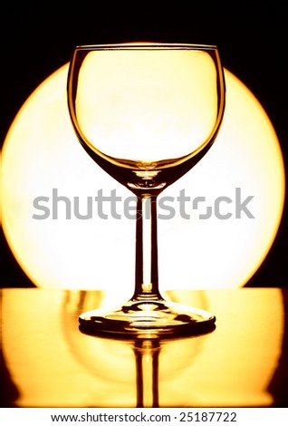 empty wine glass on shiny circle background