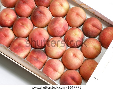 Box of yellow peaches