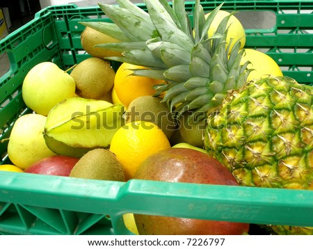 a box of fruits with pineapple