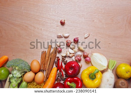 Several Organic Fruits and Vegetables on wooden as background