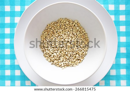 Organic Job\'s Tears in White Bowl on Nice Tablecloth.