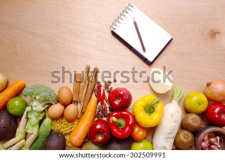 Several Organic Fruits and Vegetables on Wooden Background.