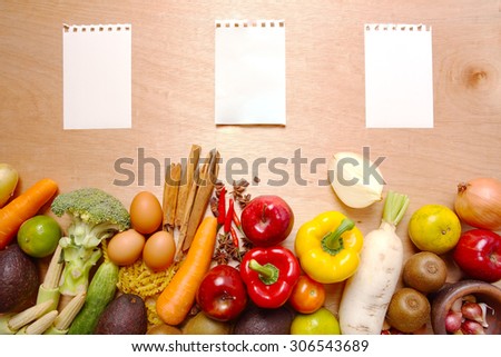 Several Organic Fruits and Vegetables on Wooden Background.