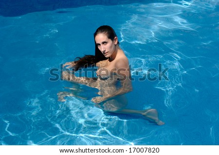 stock photo Skinny dipping woman nude woman swimming 