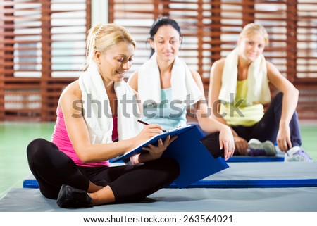 Fitness instructor is making plan for exercise