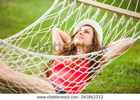 Happy girl resting in hammock