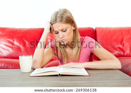 Young woman is tired of reading