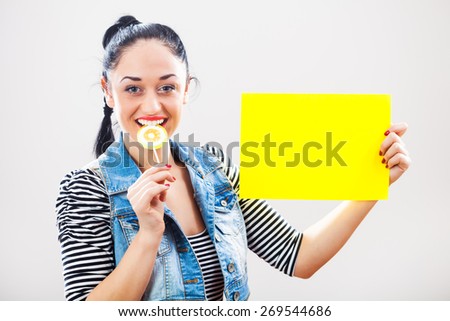 Woman holding yellow paper with blank space for text message
