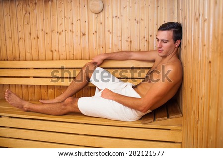 Man is enjoying in sauna