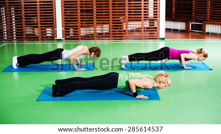 Girls practicing yoga, Yoga Chaturanga Dandasana / Four-Limbed Staff Pose